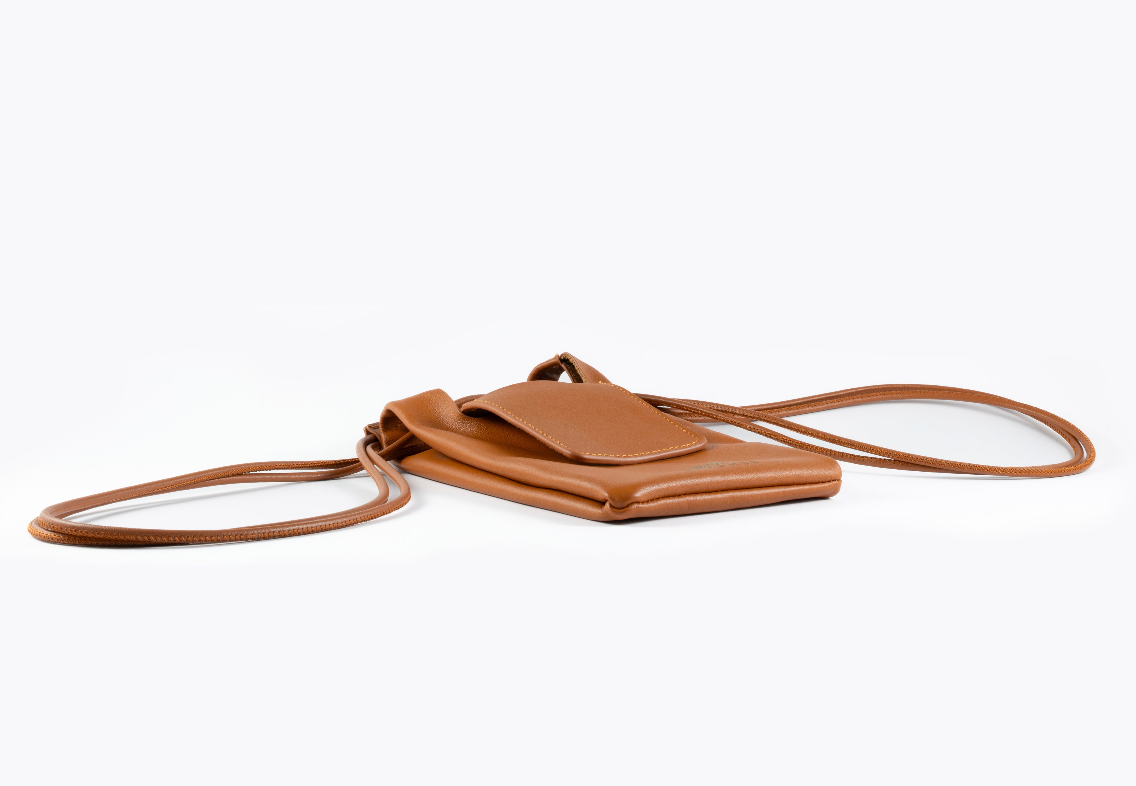 Brown leather crossbody bag on a white background